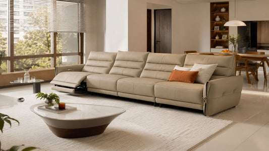 Beige modular sofa bed in a warm Singapore living room with open dining area and space-saving layout.