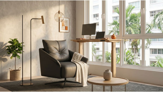 Bright HDB-style home office with standing desk, black leather lounge chair, large windows, and natural daylight