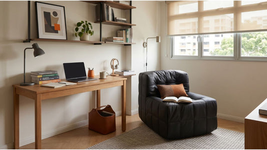 Compact children and teens study area with wooden desk, black lounge chair, and window-side storage