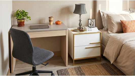 Compact HDB bedroom home office with light wood desk, grey office chair, bedside table, and warm neutral decor