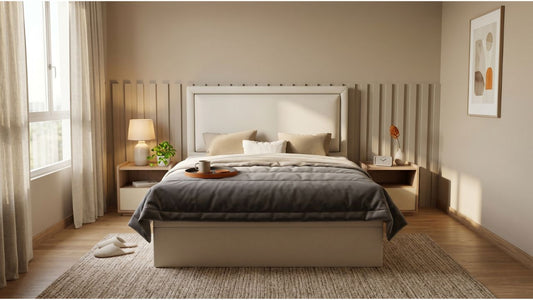 Cream upholstered bed frame at practical height in a modern Singapore bedroom with bedside tables, warm lighting, and soft neutral styling