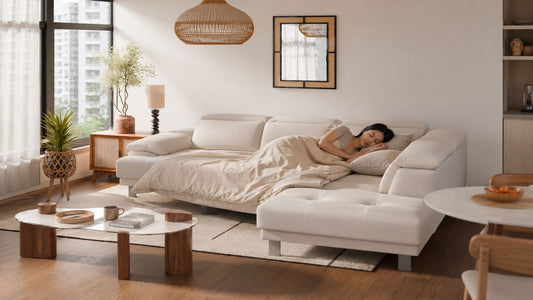Daily-use white sofa bed converted for regular sleeping in a modern Singapore living room with warm neutral styling and practical home layout.