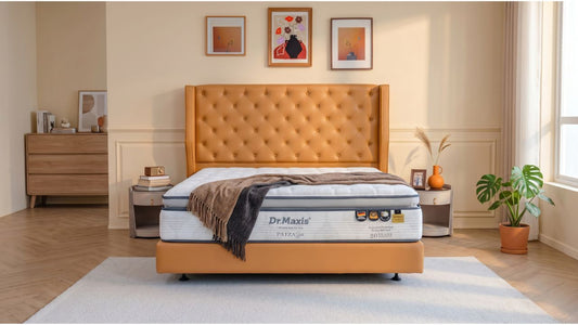 Euro-top mattress on orange tufted bed frame in a warm modern Singapore HDB bedroom