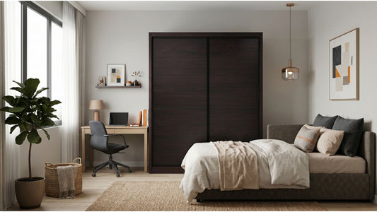 Spacious dual-purpose office and guest room with sofa bed, sliding wardrobe, compact desk, and indoor plants