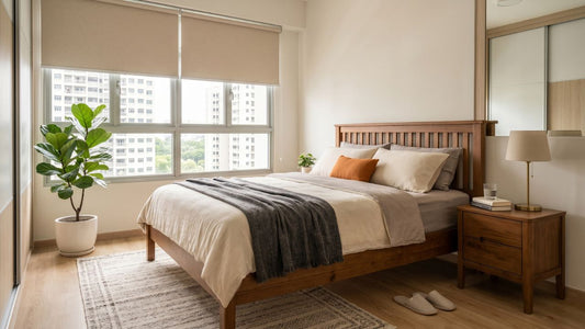 Solid wood bed frame in a bright Singapore bedroom with bedside table, highlighting durable bedroom furniture and long-term value