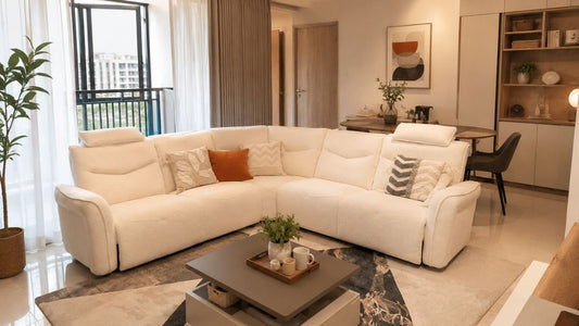 Cream sectional sofa in a modern Singapore home for first-time homeowners planning furniture shopping