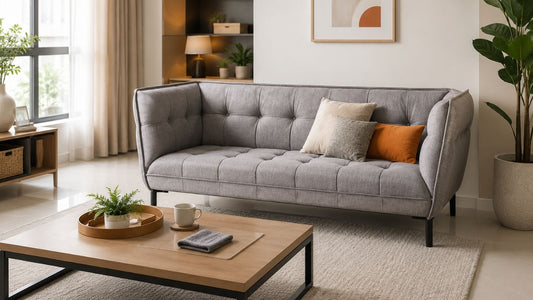 Grey fabric sofa in a modern Singapore living room for a furniture stain removal guide