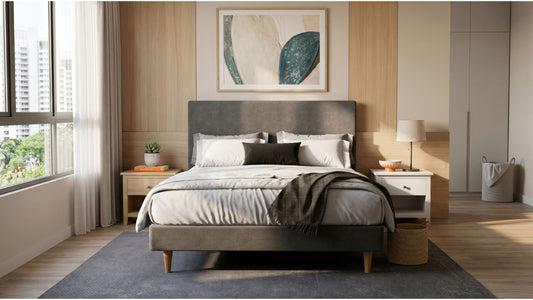 Grey upholstered bed frame with fabric headboard in a modern Singapore bedroom with wood accents