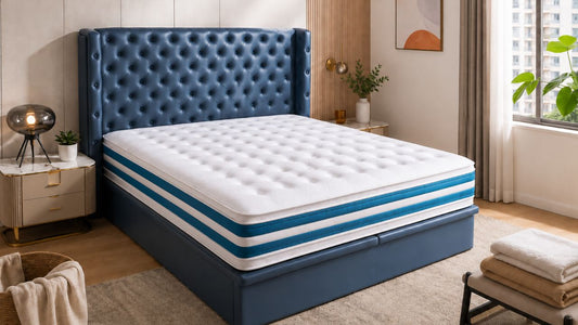 Blue tufted bed with clean white mattress in a bright Singapore bedroom, styled for a mattress cleaning and refreshing guide