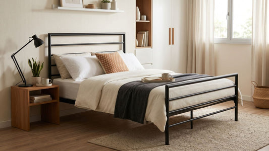 Minimalist black metal bed frame in a bright modern Singapore bedroom with neutral bedding, wooden bedside table, and soft natural light.