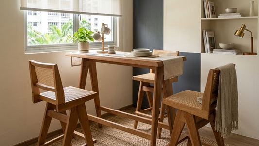 Modern wooden dining bar table with counter stools in a compact Singapore HDB apartment featuring warm neutral interiors and natural lighting