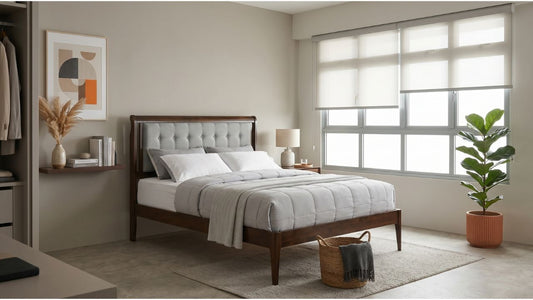 Refreshed Singapore bedroom with wooden bed frame, grey upholstered headboard, soft blinds, indoor plant, and neutral decor
