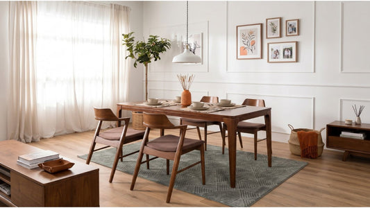 Teak dining table with wooden chairs in a bright Singapore HDB dining room with warm wood furniture